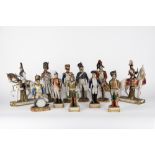 Collection of eleven porcelain figures depicting soldiers, various manufactures including Capodimont