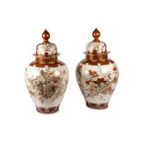 Two polychrome porcelain vases with lids, Japan, 20th century