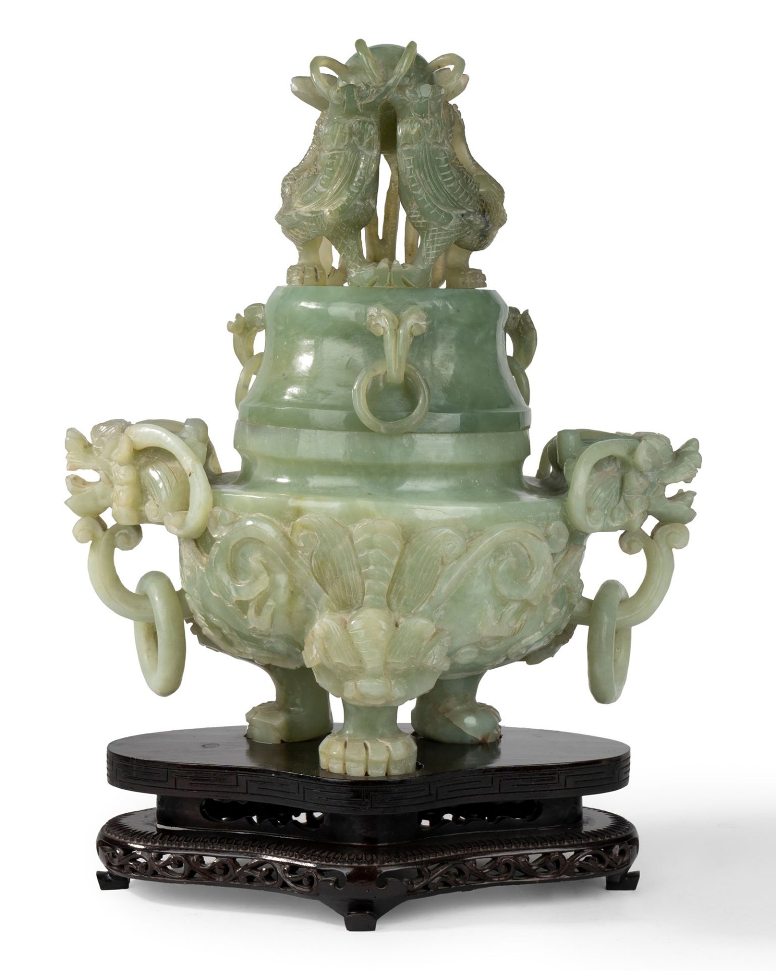 Tripod in green stone with masks and rings on a wooden base, China, 20th century