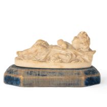 Stucco sculpture representing a boy lying down with palmette, 19th century