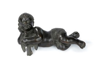 Bronze sculpture representing a putto lying down with a dove, 19th century