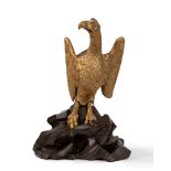 Carved and gilded wooden sculpture representing an eagle on a faux porphyry rocky outcrop, 18th cent