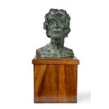 Bronze male head with wooden base, early 20th century