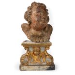 Wooden cherub head, mounted on a lacquered and gilded wooden shelf, 17th - 18th century