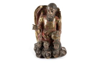 Ancient polychrome wooden sculpture representing Christ in glory with cherubs