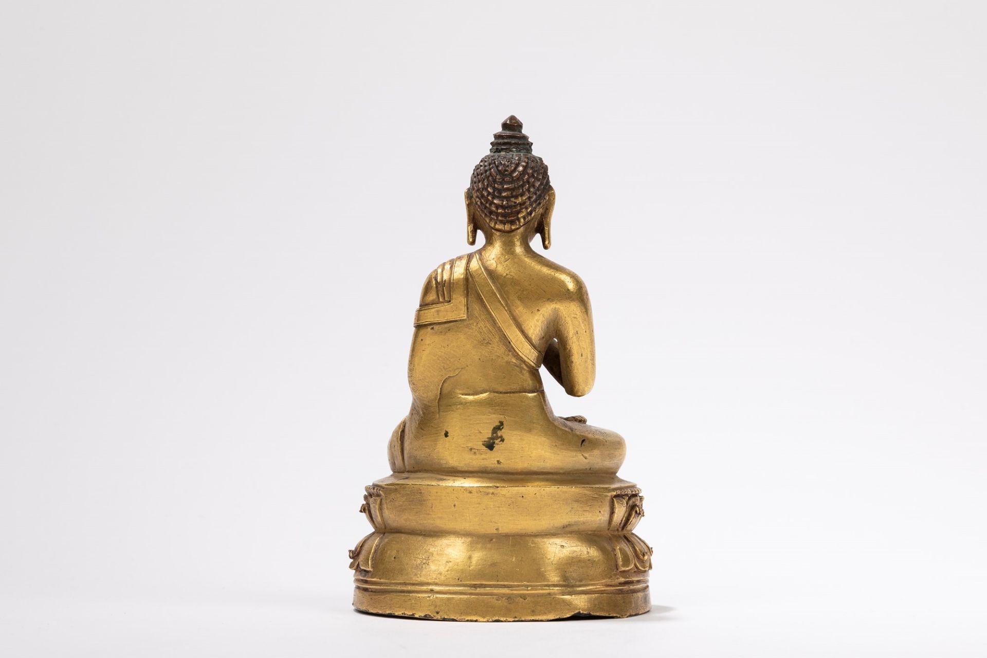 A GILT-BRONZE FIGURE OF A SEATED BUDDHA, Tibet, 18th century - Image 2 of 4