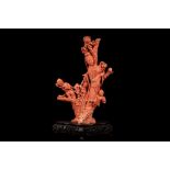 ☼A LARGE RED CORAL BEIJING STYLE CARVED FIGURE, China, early 20th century