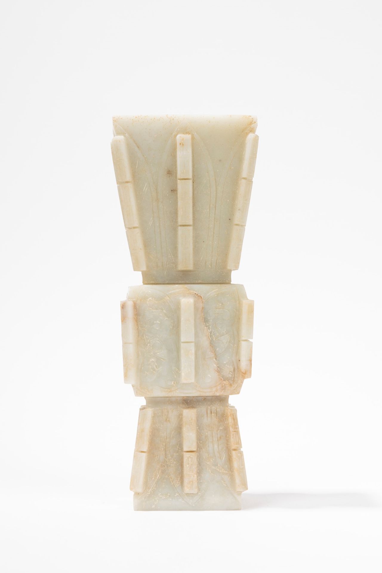 AN ARCHAISTIC MOTTLED WHITE JADE ZUN FORM VASE, China, Ming Dynasty, 17th century