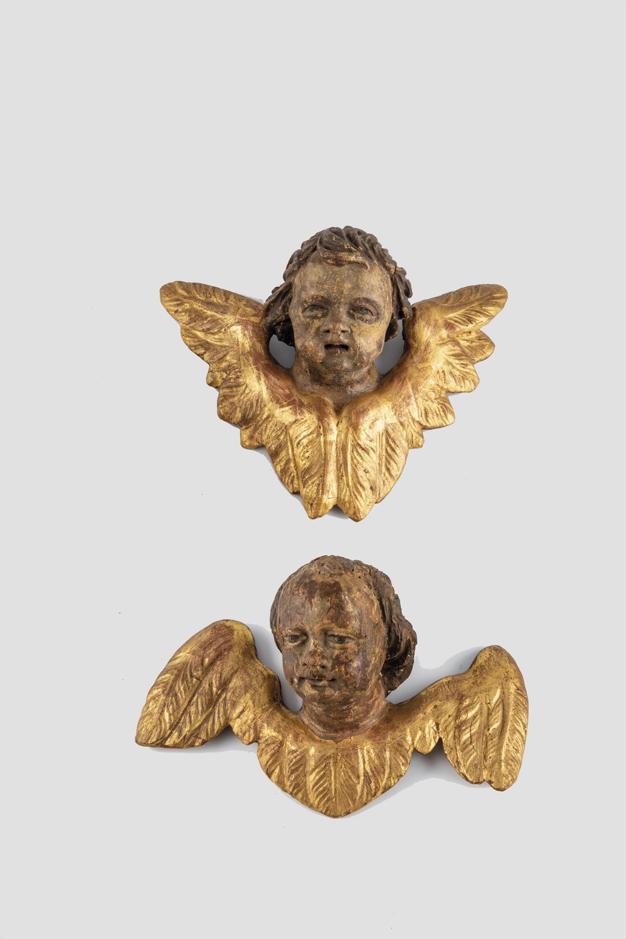 Two winged angel heads
