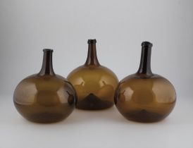 Three large spherical bottles