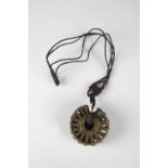 Bronze pendant with cowrie