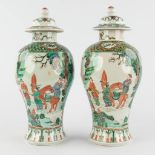 A pair of Chinese Famille Verte with farmers and symbols of happiness. 19th/20th C. (H:29 x D:13 cm)