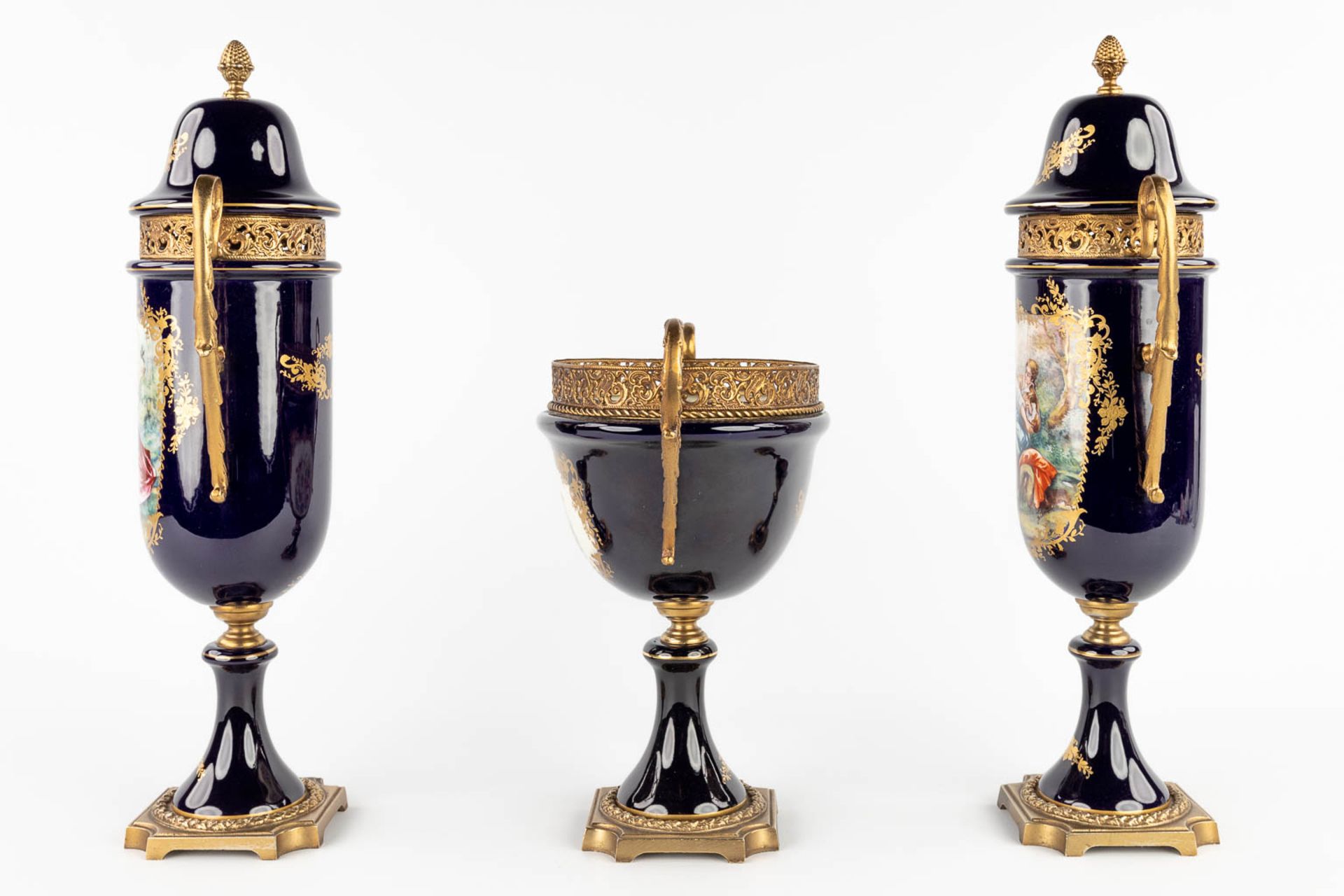 A three-piece mantle garniture, marked A.C.F. Sèvres. Porcelain mounted with bronze. 20th C. (L:11 x - Image 6 of 18