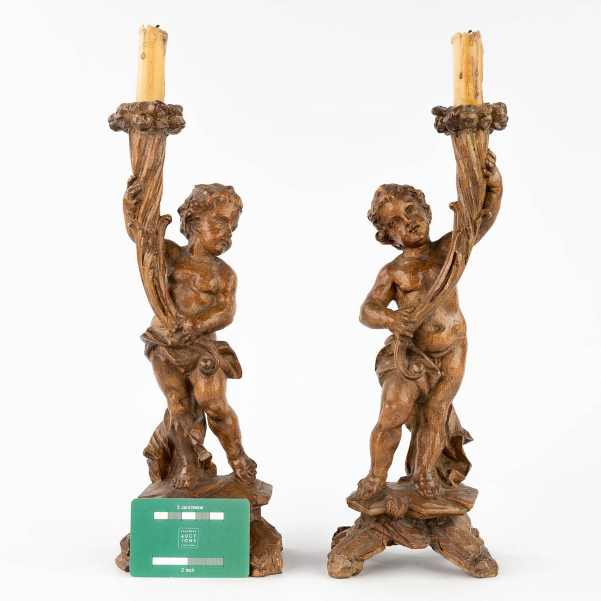 A pair of wood-sculptured candle holders, with putti. 19th C. (L:9 x W:12 x H:34 cm) - Image 2 of 12