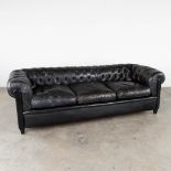 A three-person black leather sofa, Chesterfield. (L:82 x W:222 x H:72 cm)