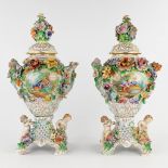 Dresden, a pair of Rococo inspired vases, richly decorated with flowers and hand-painted decors. 20t