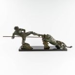 P. BERJEAN (XX) Fighting a lion, patinated bronze, marble. (L:29 x W:100 x H:37 cm)