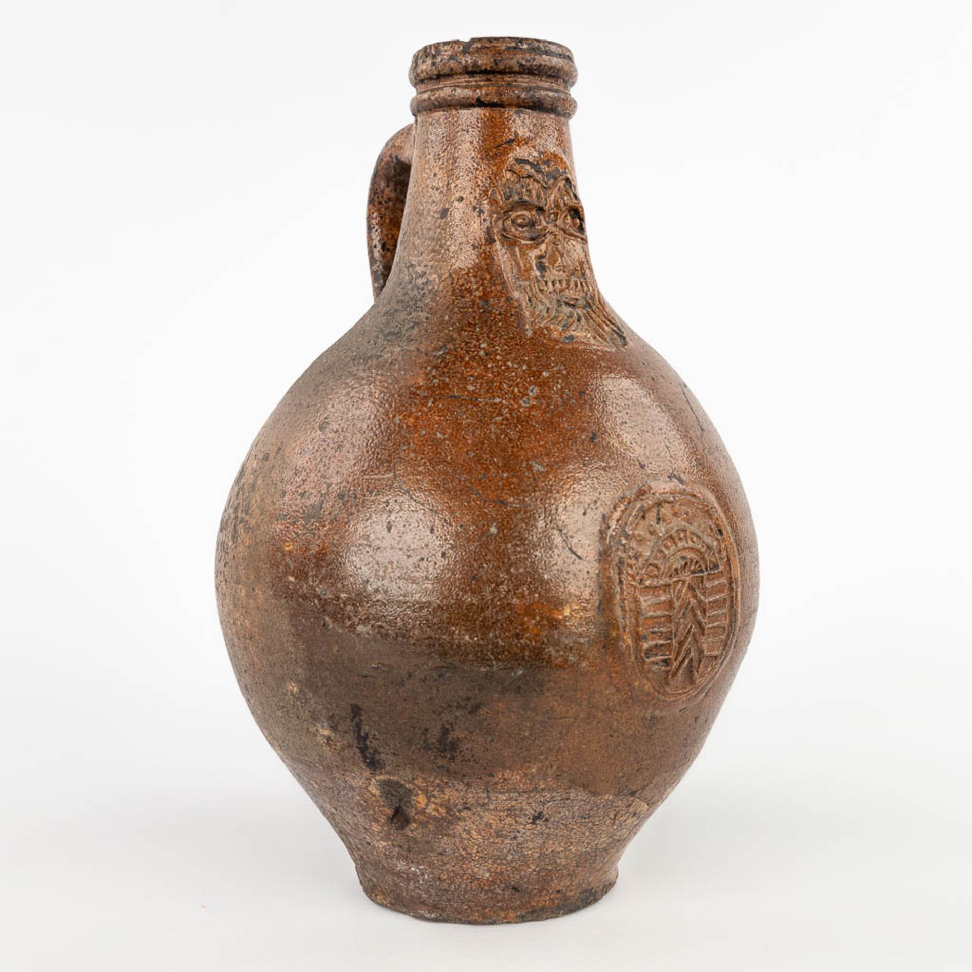 An antique Bartman jug with a single cartouche. 17th C. (H:28 x D:18 cm)
