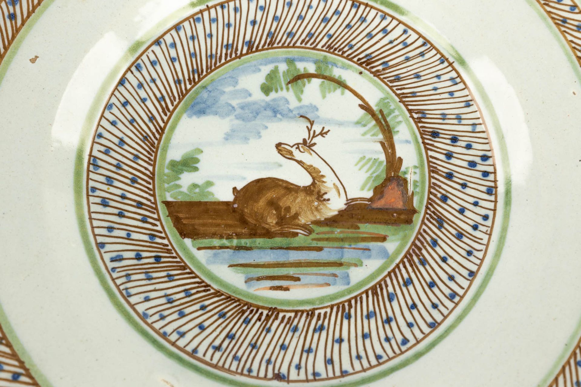 Three pieces of Delfts Faience, two plates with deer and a strainer. 18th C. (D:23 cm) - Image 10 of 18