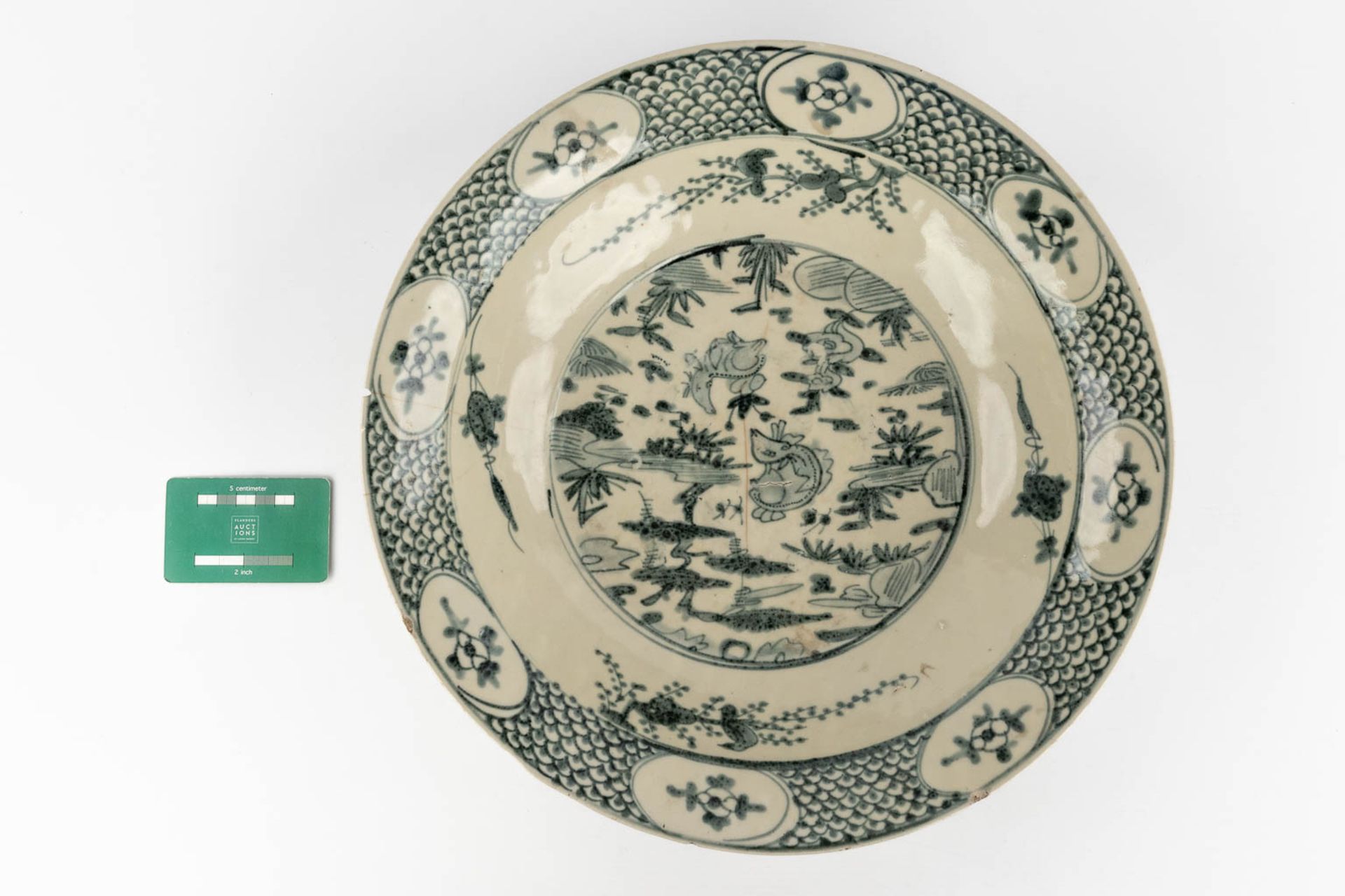 A large Chinese plate with blue-white decor 'Resting Deer'. (H:9 x D:39 cm) - Image 2 of 15