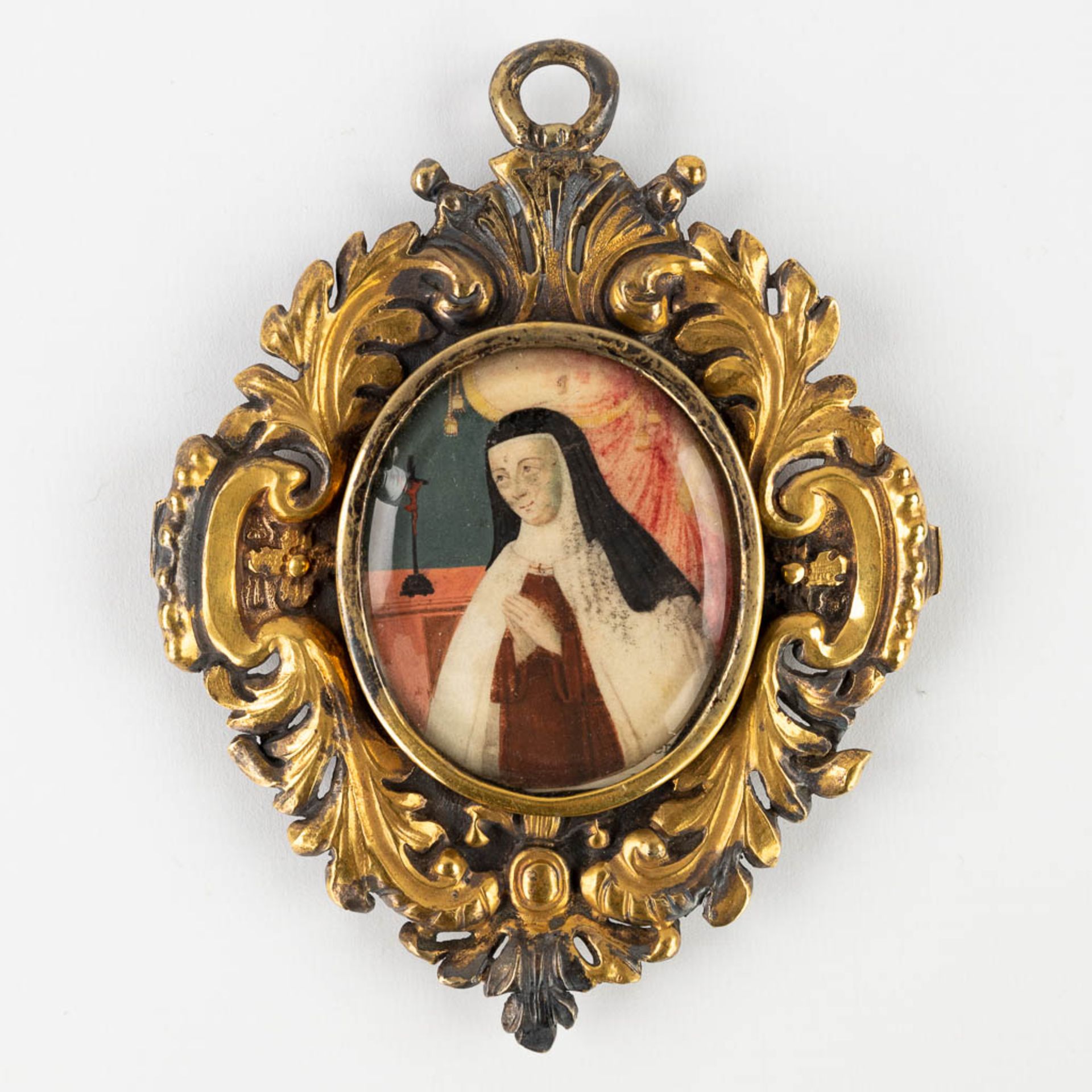 A Theca with a relic, with a miniature painting of Mother Mary on parchment and mounted in a silver