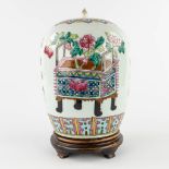 A Chinese ginger jar decorated with a double bonsai and flower vases. (H:30 x D:22 cm)