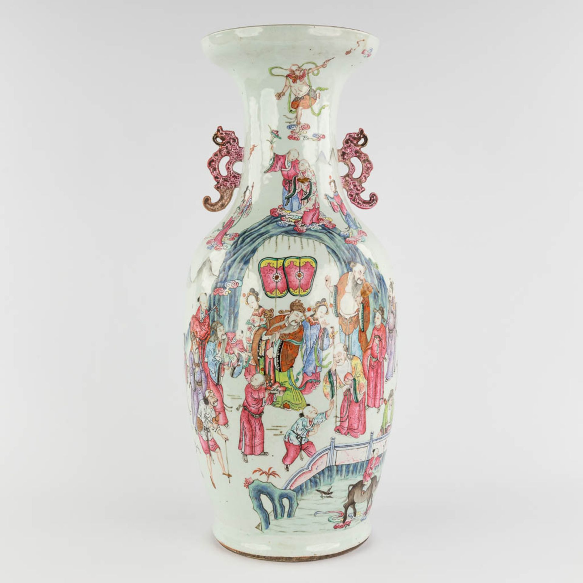 A Chinese Famille Rose vase, decorated with Wise men and items of good fortune. 19th C. (H:60 x D:25