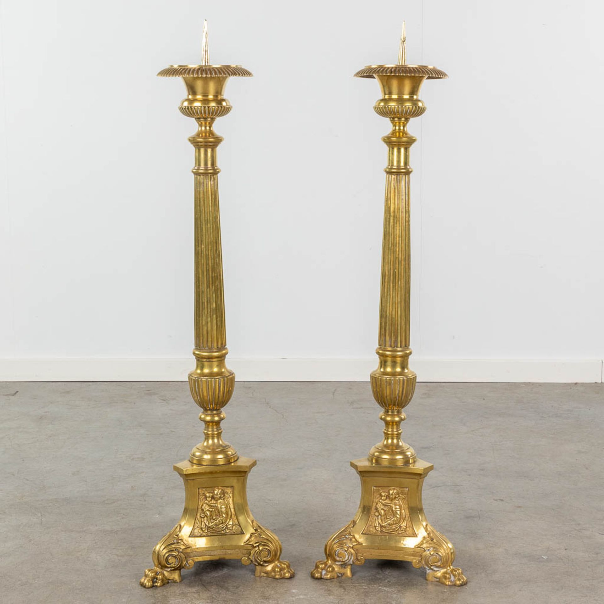 A pair of gold-plated and bronze church candle holders. Images of Joseph, Jesus and Mary. 19th C. (H - Image 4 of 12