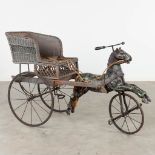 A children's horse-drawn carriage, with a bicycle wood horse. Circa 1950. (L:61 x W:150 x H:94 cm)