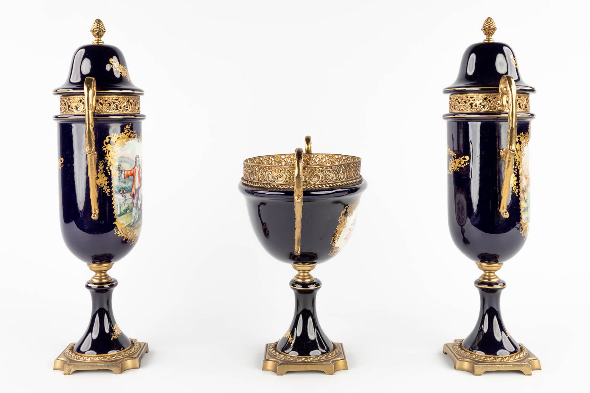 A three-piece mantle garniture, marked A.C.F. Sèvres. Porcelain mounted with bronze. 20th C. (L:11 x - Image 4 of 18