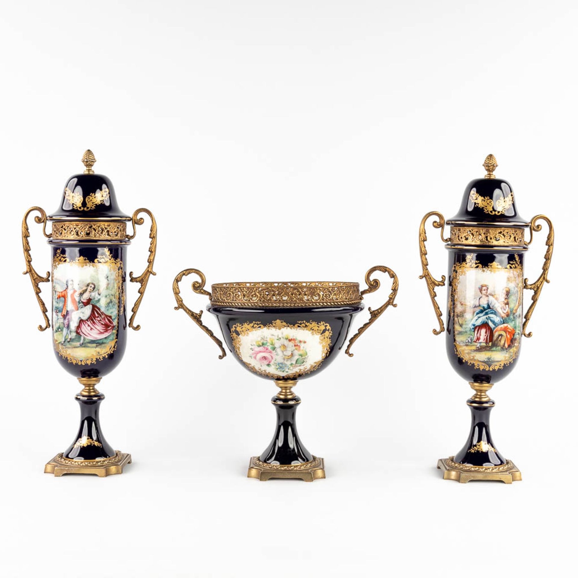A three-piece mantle garniture, marked A.C.F. Sèvres. Porcelain mounted with bronze. 20th C. (L:11 x