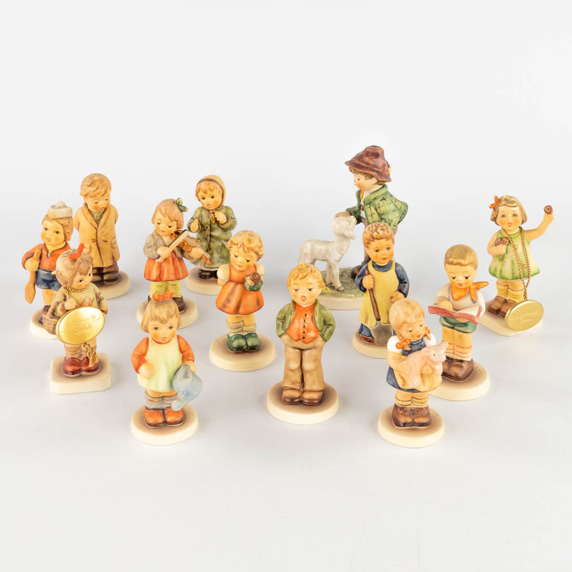 Hummel, a set of 13 small figurines. (H:12,5 cm)