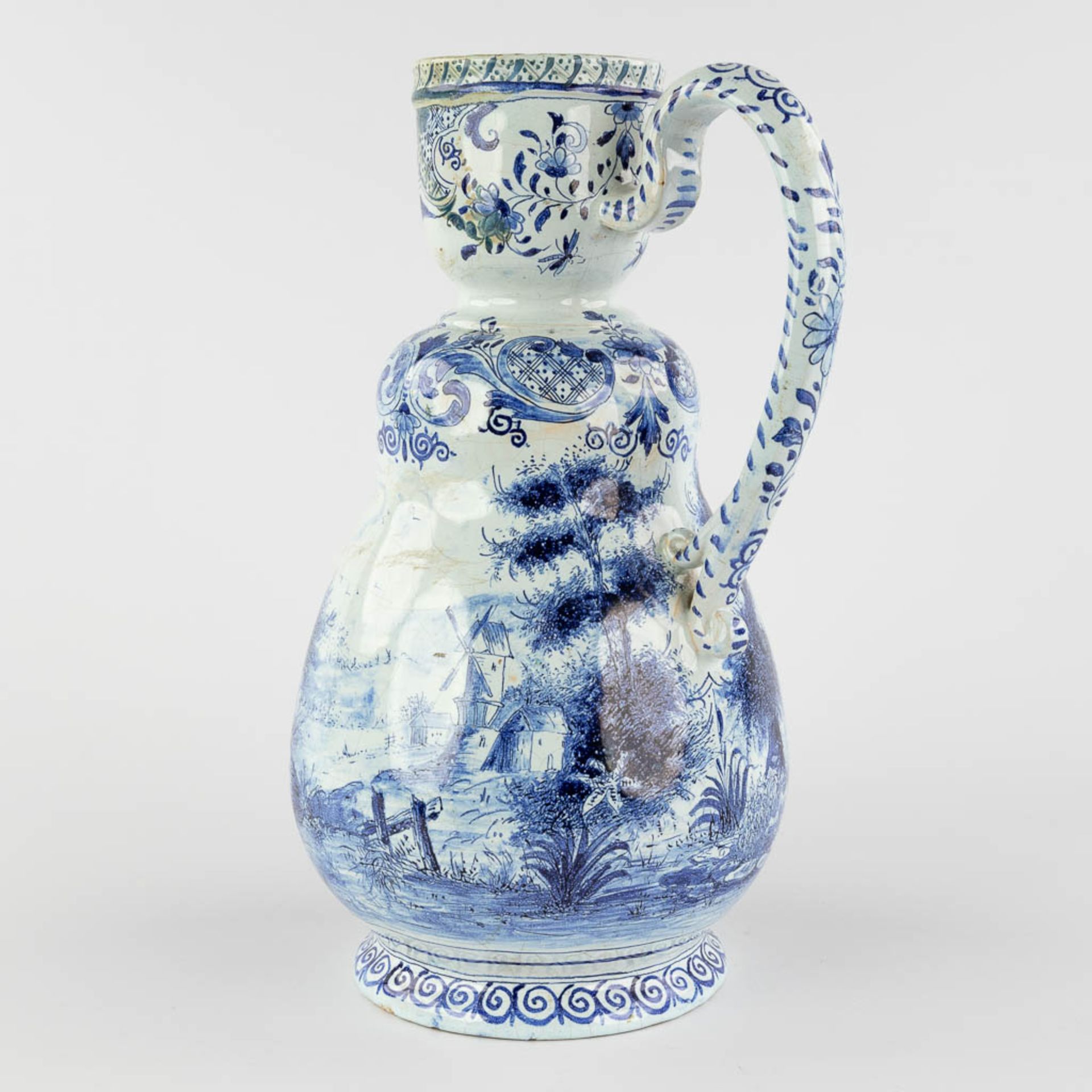 Delft, an antique pitcher with romantic scène, blue-white faience. 18th c. (L:17 x W:20 x H:33 cm) - Image 6 of 20