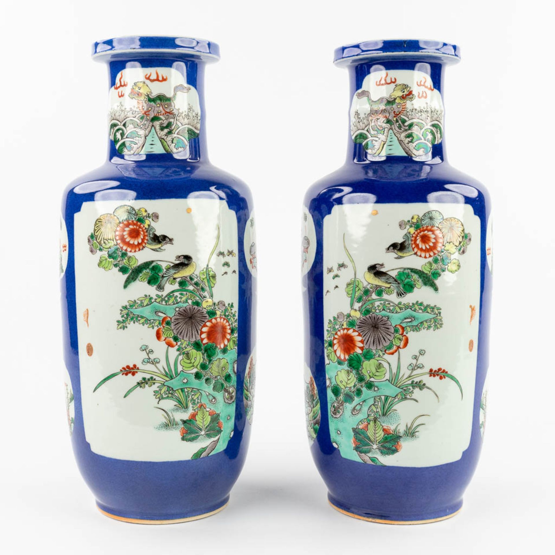 A pair of Chinese vases, decorated with fauna and flora. 20th C. (H:45 x D:18 cm)