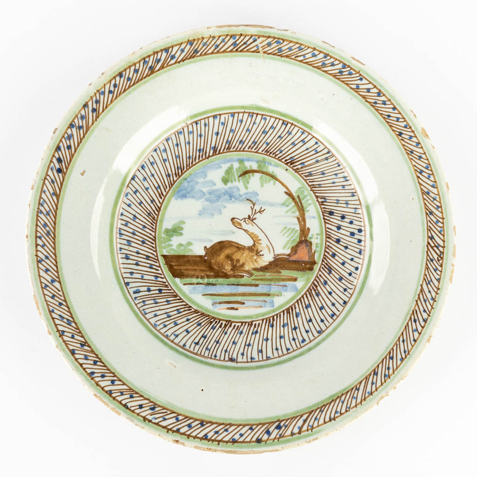 Three pieces of Delfts Faience, two plates with deer and a strainer. 18th C. (D:23 cm) - Image 9 of 18