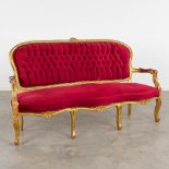 A 3-seater settee, sculptured wood upholstered with fabric. 20thC. (L:66 x W:168 x H:97 cm)