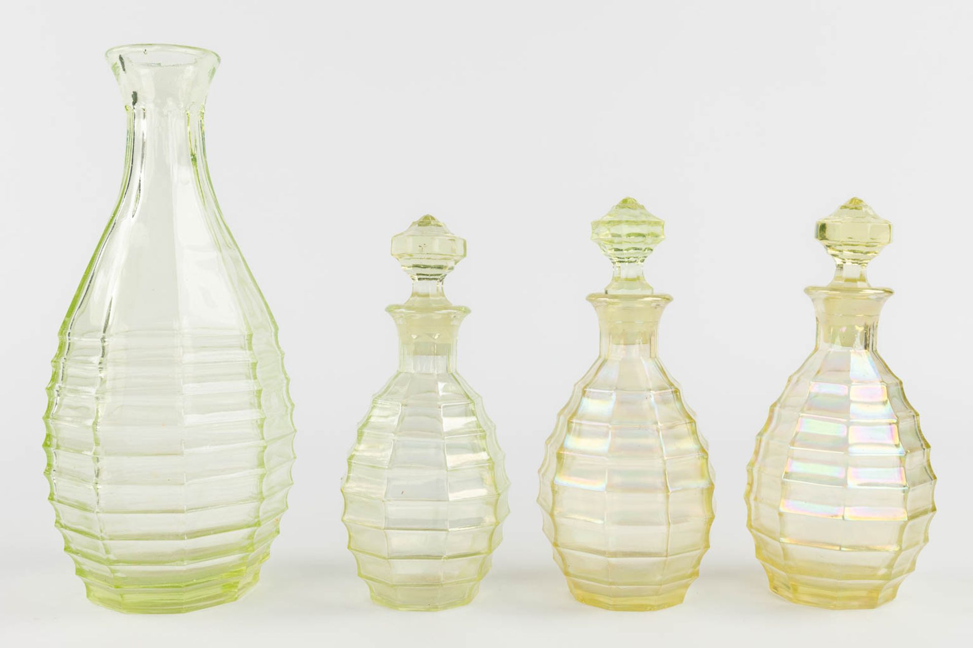 A 9-piece perfume set, made of Uranium glass. (H:21 x D:9 cm) - Image 5 of 15