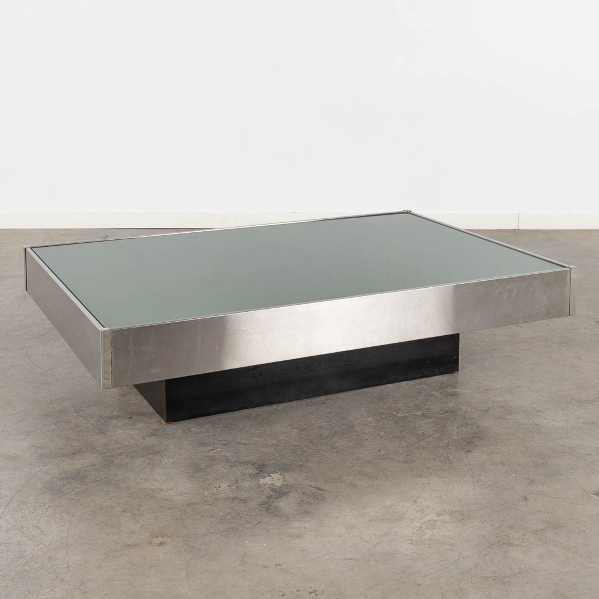 A coffee table, tinted glass and chrome, in the style of Willy Rizzo. (L:80 x W:120 x H:31 cm)