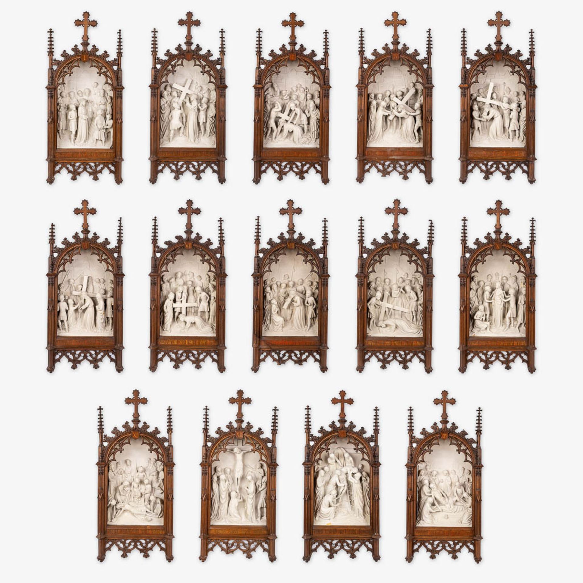 An extensive 14-piece 'Stations Of The Cross', plaster with gothic revival, wood-sculptured frames.