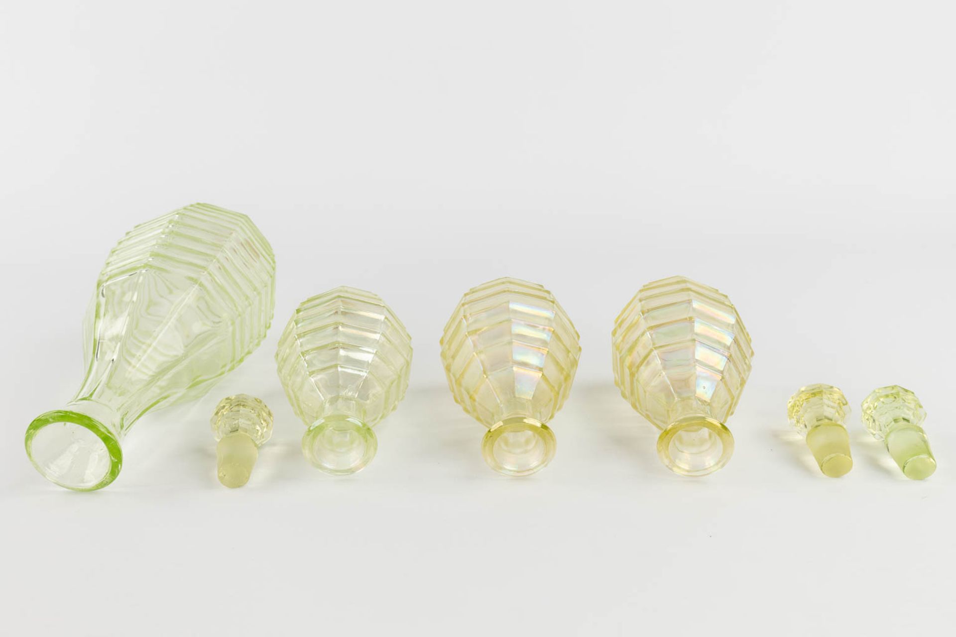 A 9-piece perfume set, made of Uranium glass. (H:21 x D:9 cm) - Image 6 of 15