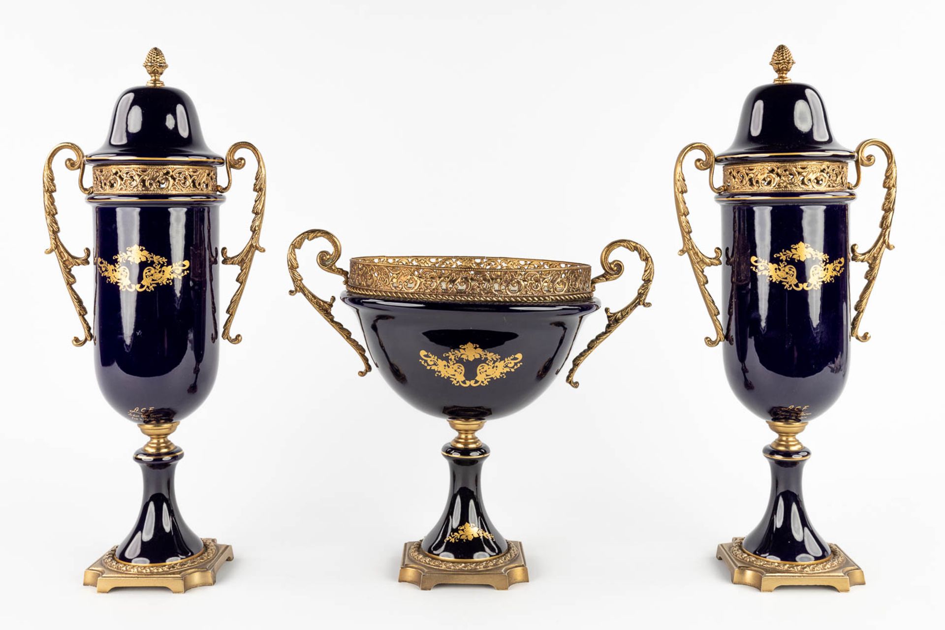 A three-piece mantle garniture, marked A.C.F. Sèvres. Porcelain mounted with bronze. 20th C. (L:11 x - Image 5 of 18