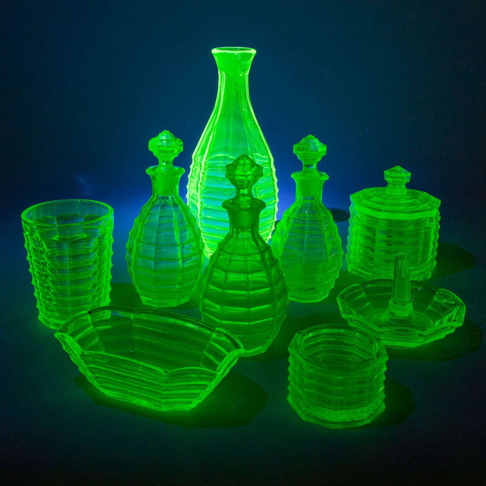 A 9-piece perfume set, made of Uranium glass. (H:21 x D:9 cm) - Image 4 of 15