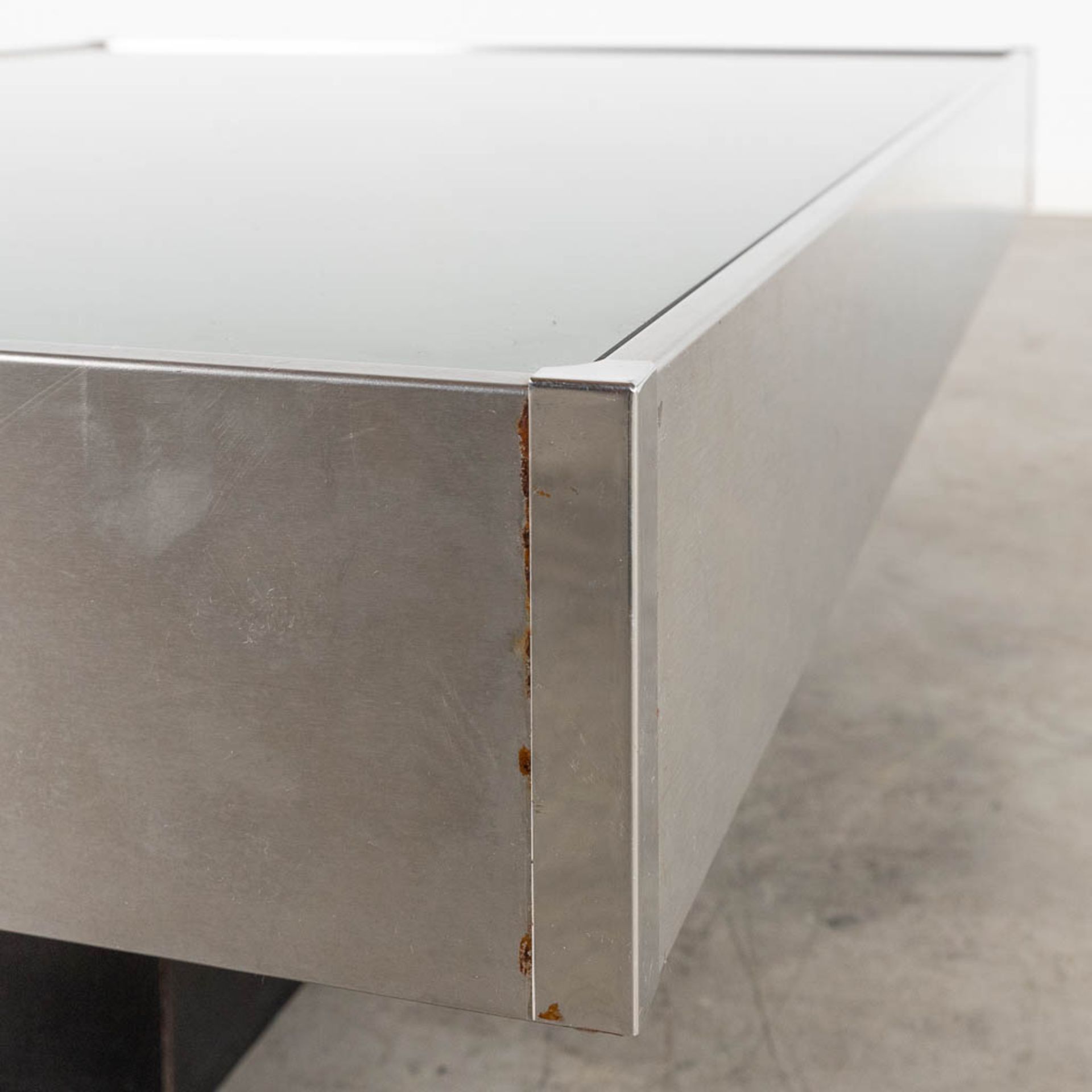 A coffee table, tinted glass and chrome, in the style of Willy Rizzo. (L:80 x W:120 x H:31 cm) - Image 7 of 10