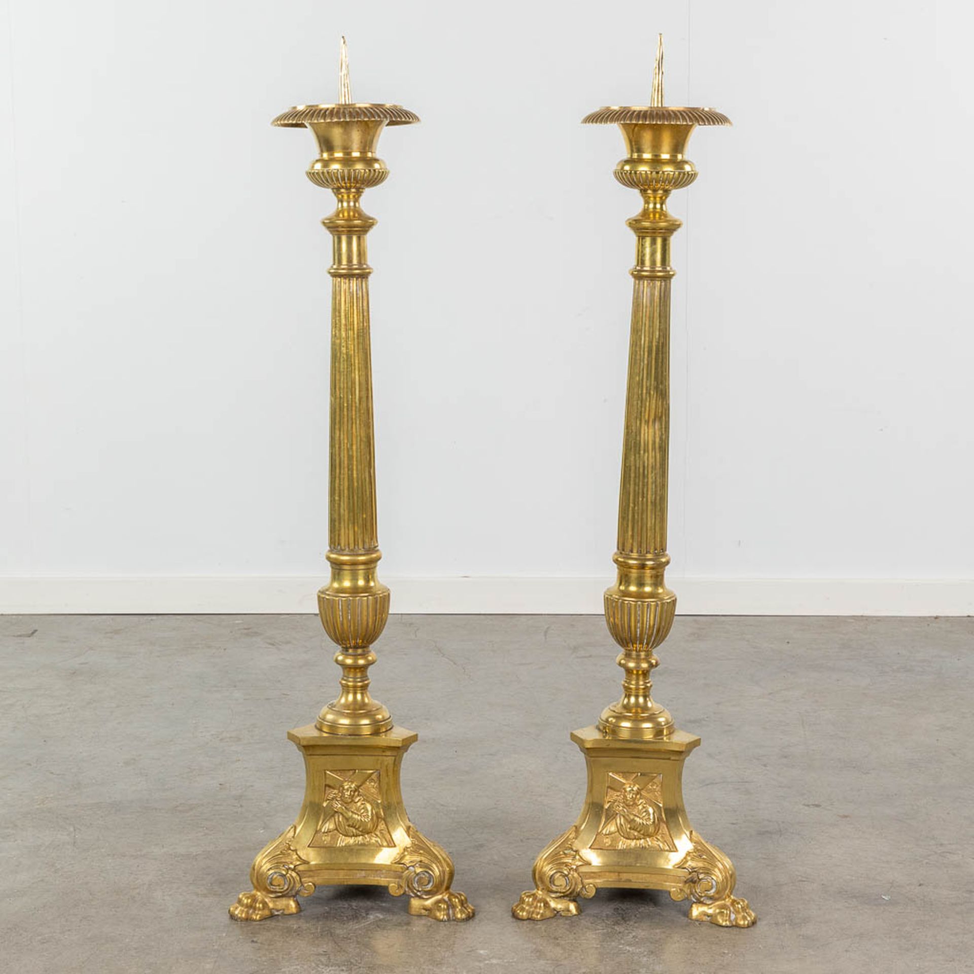 A pair of gold-plated and bronze church candle holders. Images of Joseph, Jesus and Mary. 19th C. (H