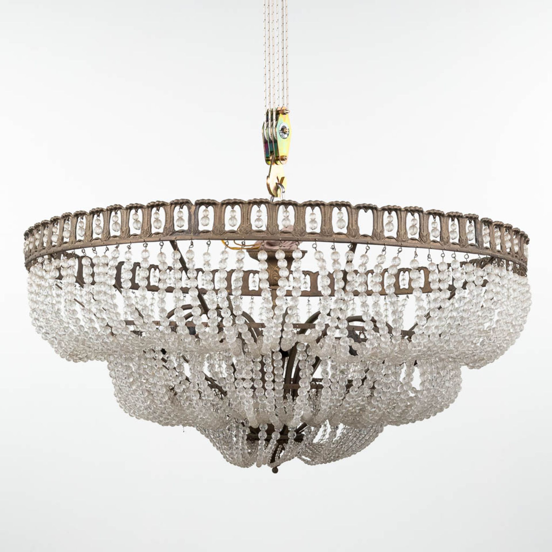 A large chandelier 'Sac A Perles' made of brass and glass. (H:40 x D:91 cm)