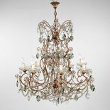 A decorative chandelier, brass decorated with clear and coloured glass. (H:80 x D:74 cm)
