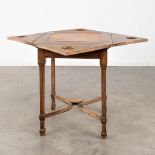 An antique game table with folding top. 19th C. (L:84 x W:84 x H:77 cm)