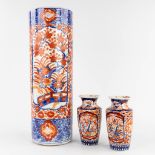 Three pieces of Japanese Imari porcelain, an umbrella stand and a pair of vases. 19th/20th C. (H:60