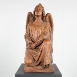 A large figurine of an angel, terracotta. 19th C. (L:45 x W:38 x H:75 cm)