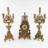 A three-piece mantle garniture clock and candelabra, bronze, circa 1900. (L:11 x W:26 x H:56 cm)